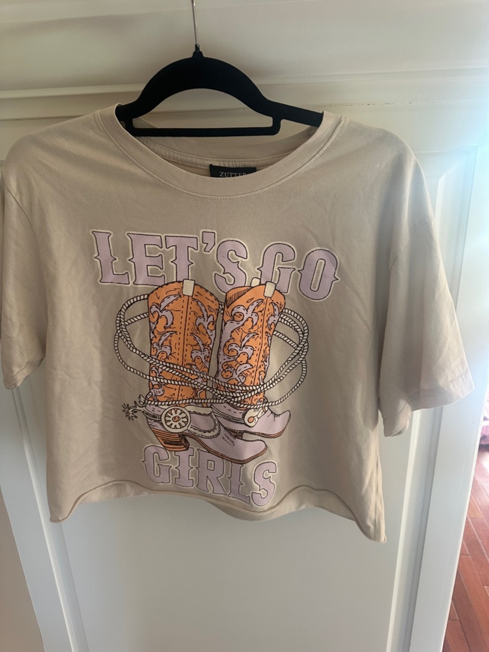 Zutter LET'S GO Girls Cropped Graphic Tee in Cream with Orange Boots